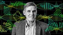 A man in a checked jacket and collared shirt stands in front of a digital background featuring stylized DNA strands and data graphs.