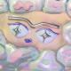 Abstract illustration of stylized eyes, eyebrow, and mouth surrounded by pastel-colored, jelly-like shapes with various patterns and textures—evoking a sense of cryopreservation through cool hues and frozen motifs.